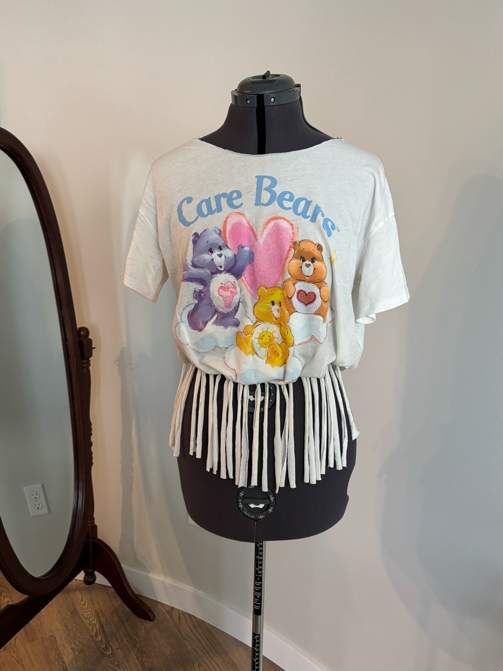 Care Bears White Fringe Crop Tee with Pastel Graphic